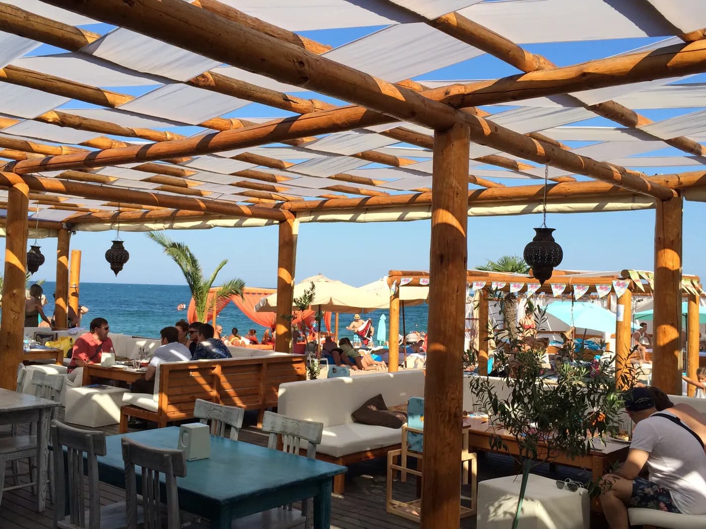 Beachfront lounge under a pergola