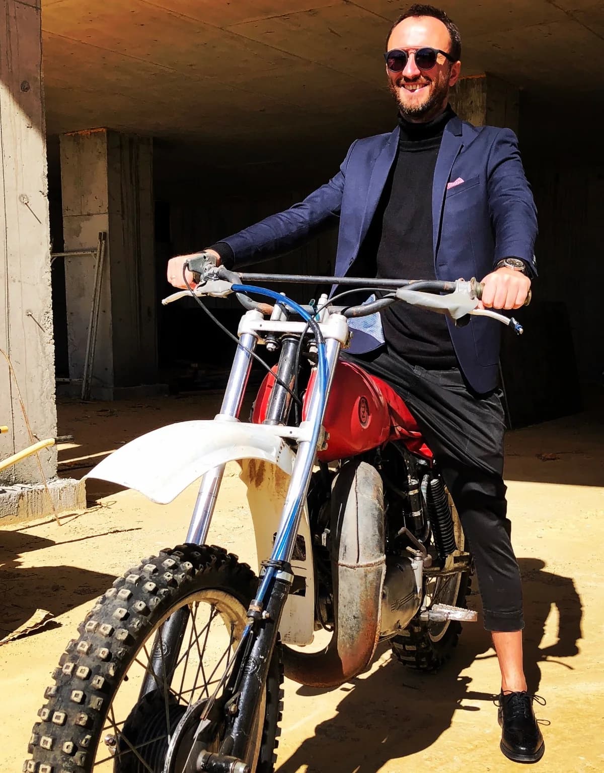 Tukenbai Shadykhanov on a vintage motorbike