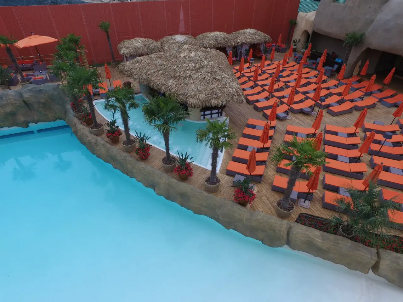 Pool with sun loungers before opening