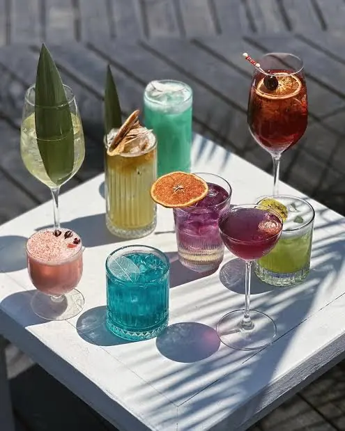 Signature cocktails on a terrace table